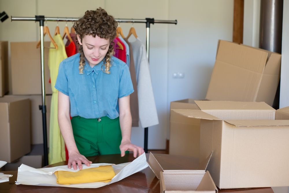 Online shop owner preparing customer orders